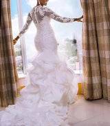 Ruffeled Mermaid Wedding dress. Lace Long sleeved wedding gown