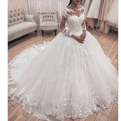 Ballgown Wedding  Dress. Long sleeved  bridal gown with train.
