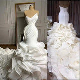 Ellegant Mermaid Wedding Gown. Ruffeled bridal gown with train.