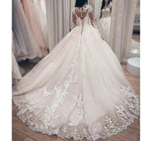Ballgown Wedding  Dress. Long sleeved  bridal gown with train.